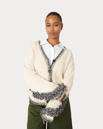 Female Model is wearing Aspen Fringe Cardigan in Cream Mixed Knit in size Small 