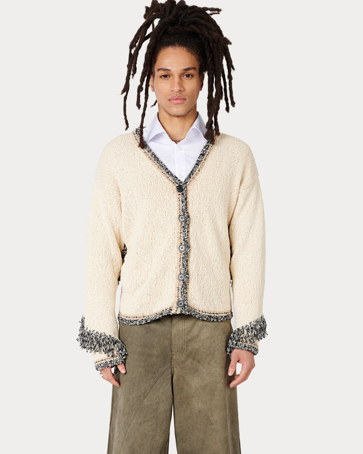  Male Model is wearing Aspen Fringe Cardigan in Cream Mixed Knit by Aseye Studio