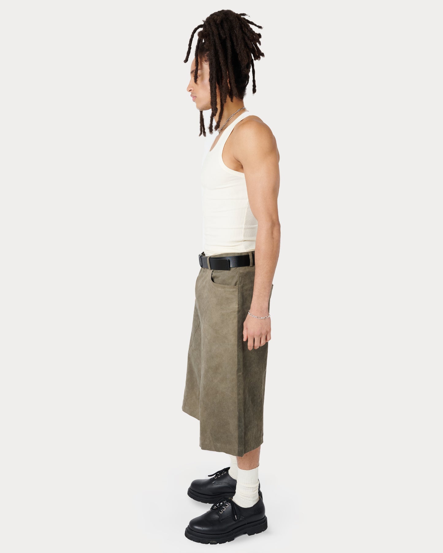 Side view of model wearing size Medium in Mens Tommi Shorts by Aseey Studio