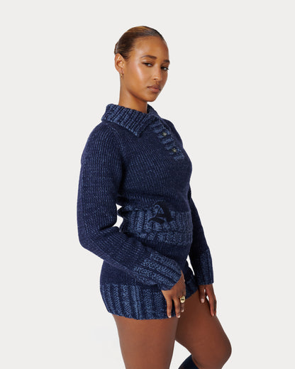 Model is wearing size Medium in Zaya Knit Top by Aseye Studio in Dark Blue